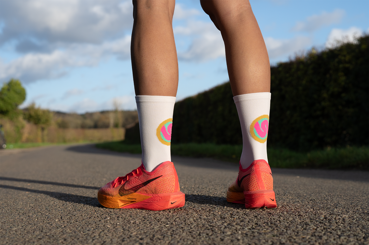 SUSPENSE RUNNING & CYCLING SOCKS: HOT PINK & GOLD CIRCLE